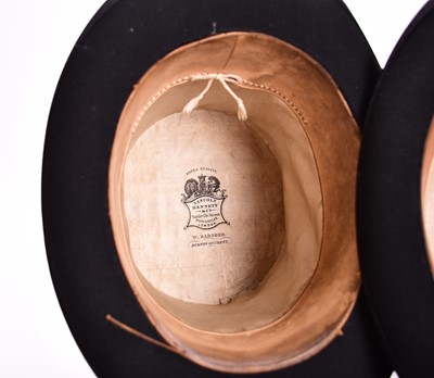 Lot 433 - Two black silk top hats, boxed