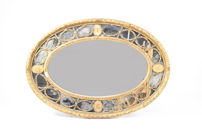 Lot 268 - A Regency revival giltwood and gesso oval overmantel mirror, 19th century