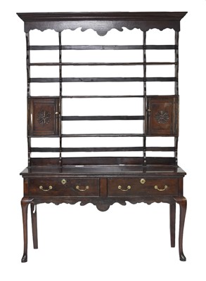 Lot 332 - An 18th century oak dresser and rack