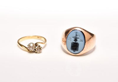 Lot 226 - A hardstone set signet ring and a two stone diamond crossover ring