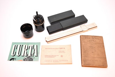 Lot 441 - A Curta Type 1 Calculator and a cased slide rule