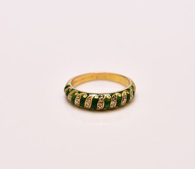 Lot 100 - A French diamond and green enamel ring