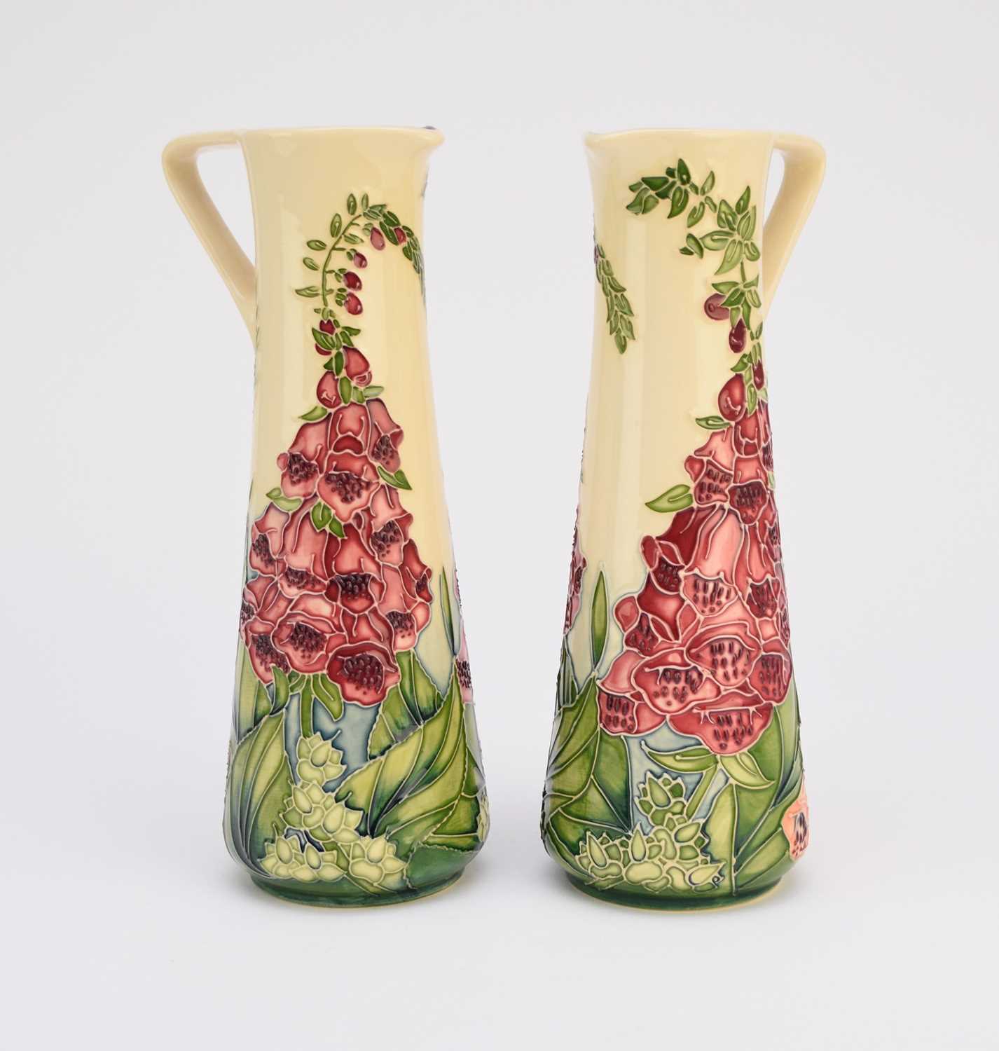 Lot 186 - A pair of Moorcroft 'Amberwood' jugs designed by Rachel Bishop, dated 2002