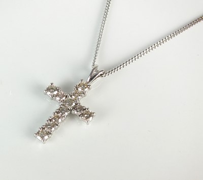 Lot 92 - An 18ct white gold diamond set crucifix pendant