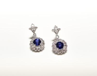 Lot 298 - A pair of 18ct white gold sapphire and diamond earrings