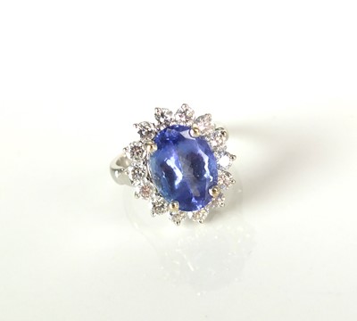 Lot 310 - A tanzanite and diamond oval cluster ring