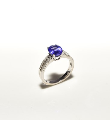 Lot 282 - An 18ct white gold tanzanite and diamond ring