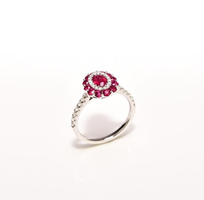 Lot 230 - A ruby and diamond cluster ring