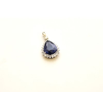 Lot 182 - A sapphire and diamond cluster pendant