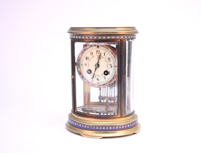 Lot 447 - A French gilt brass and champleve enamel mantel clock