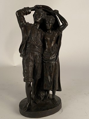 Lot 519 - After Fernand Lorrain (19th century), a bronze figure of lovers sheltering from the rain