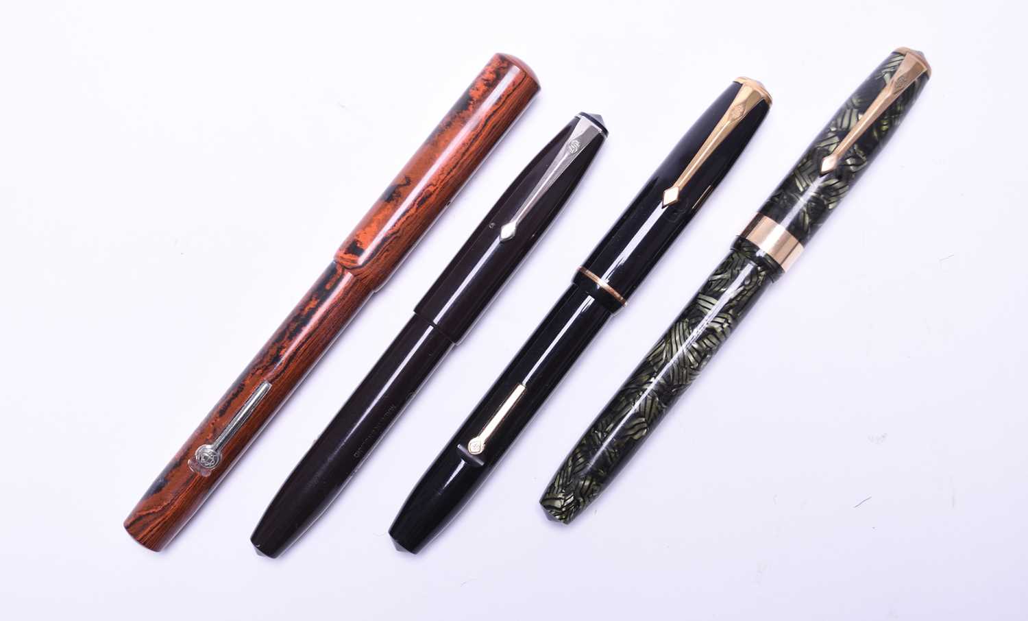 Lot 385 - Four vintage Conway Stewart fountain pens