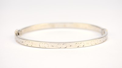 Lot 269 - A white metal hinged bangle