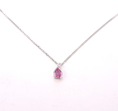 Lot 179 - An 18ct white gold pink sapphire and diamond pendant on chain