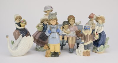 Lot 268 - Eight Lladro and one Nao figures