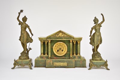 Lot 619 - A French onyx and gilt metal clock garniture