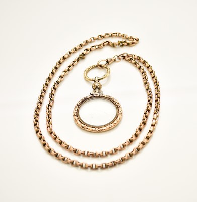 Lot 122 - A rose metal chain with yellow metal mounted magnifying glass