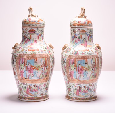 Lot 58 - A pair of Chinese Canton famille rose porcelain vases and covers, 19th century