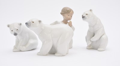 Lot 269 - Three Lladro polar bears and a Lladro Angel Praying