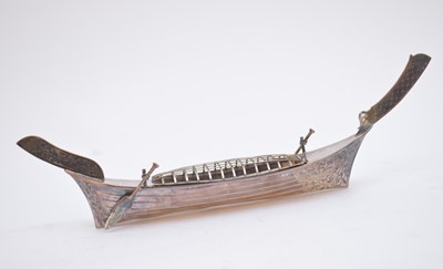 Lot 60 - A white metal long boat