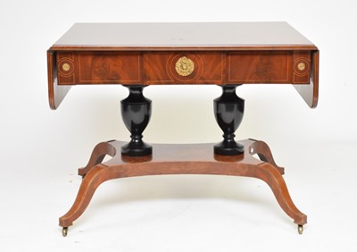 Lot 183 - A Regency style parcel ebonised mahogany sofa table