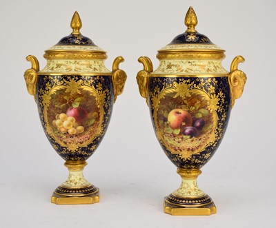 Lot 89 - A pair of Coalport vases and covers painted with fruit by Chivers