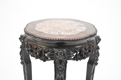 Lot 95 - A Chinese hardwood urn stand, Qing Dynasty