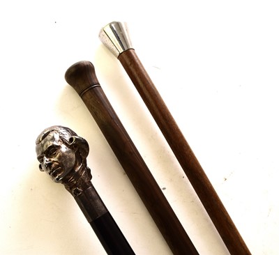 Lot 569 - A white metal figural cane and two other canes