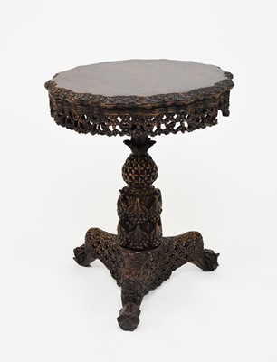 Lot 129 - A Burmese carved hardwood tilt-top table, 19th century