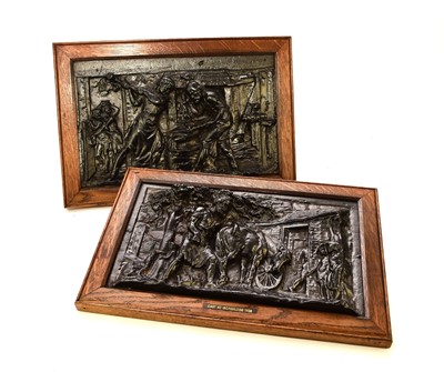 Lot 571 - A pair of Coalbrookdale cast iron plaques representing blacksmithing