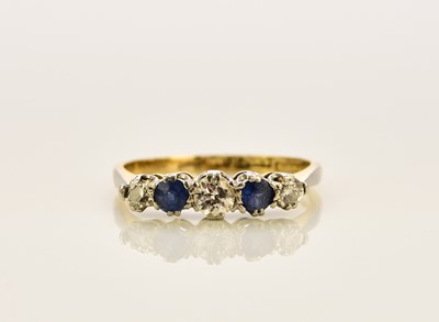 Lot 337 - A graduated five stone diamond and sapphire ring