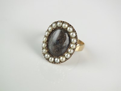 Lot 216 - A 19th century split seed pearl and plaited hair mourning ring