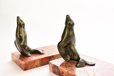 Lot 547 - An Austrian bronze figure of a dog and two bronze seal bookends