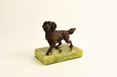 Lot 547 - An Austrian bronze figure of a dog and two bronze seal bookends
