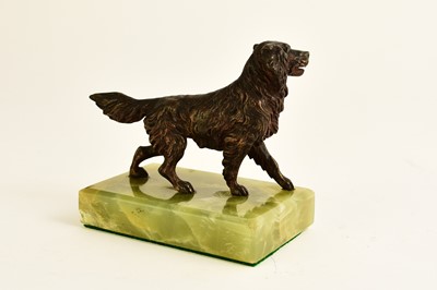 Lot 547 - An Austrian bronze figure of a dog and two bronze seal bookends