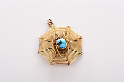 Lot 312 - A yellow metal turquoise and seed pearl spider web pendant