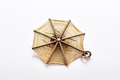 Lot 312 - A yellow metal turquoise and seed pearl spider web pendant