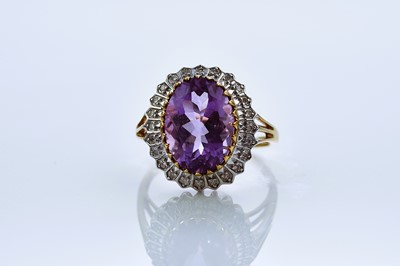 Lot 143 - A 9ct gold amethyst and diamond ring