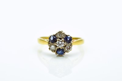 Lot 213 - An 18ct gold sapphire and diamond circular cluster ring