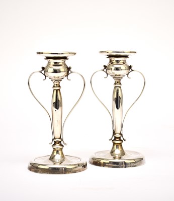 Lot 8 - A pair of early 20th century silver candlesticks