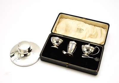 Lot 98 - A cased three piece silver cruet set and a silver mounted inkwell