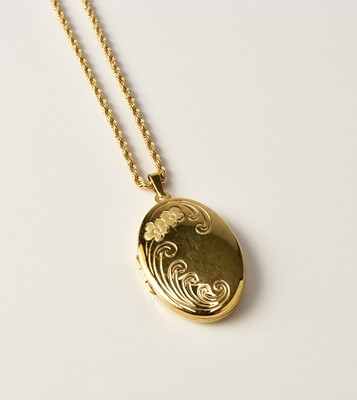 Lot 207 - An oval bright cut engraved locket on chain