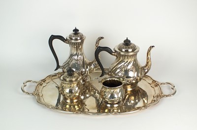 Lot 1 - A four piece silver tea service and plated tray