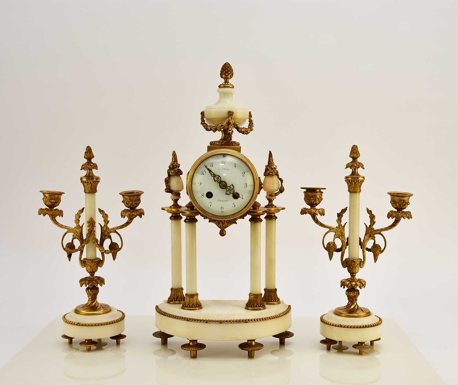 Lot 621 - A late 19th century French Portico clock garniture