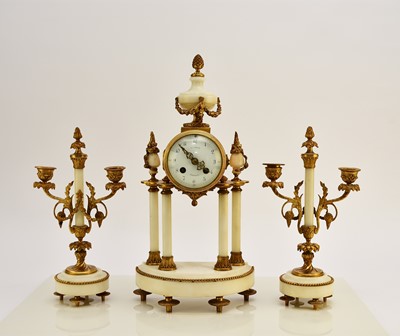 Lot 621 - A late 19th century French Portico clock garniture