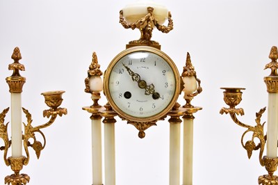 Lot 621 - A late 19th century French Portico clock garniture