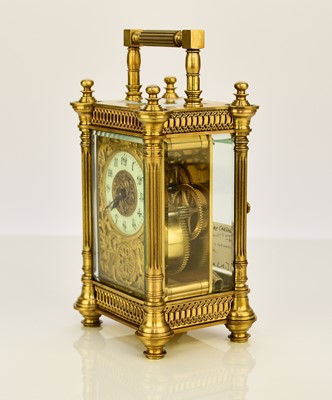 Lot 634 - A French early 20th century brass carriage timepiece