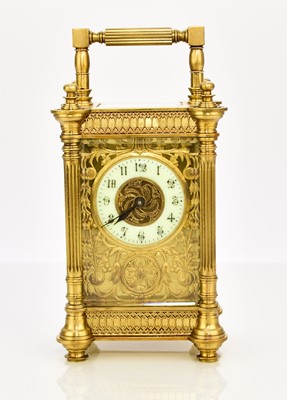 Lot 634 - A French early 20th century brass carriage timepiece
