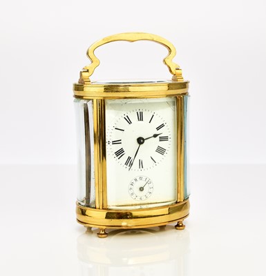 Lot 636 - A French brass oval carriage alarm clock, early 20th century