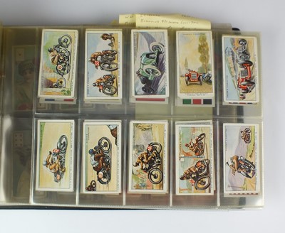 Lot 583 - An album containing sets of cigarette cards